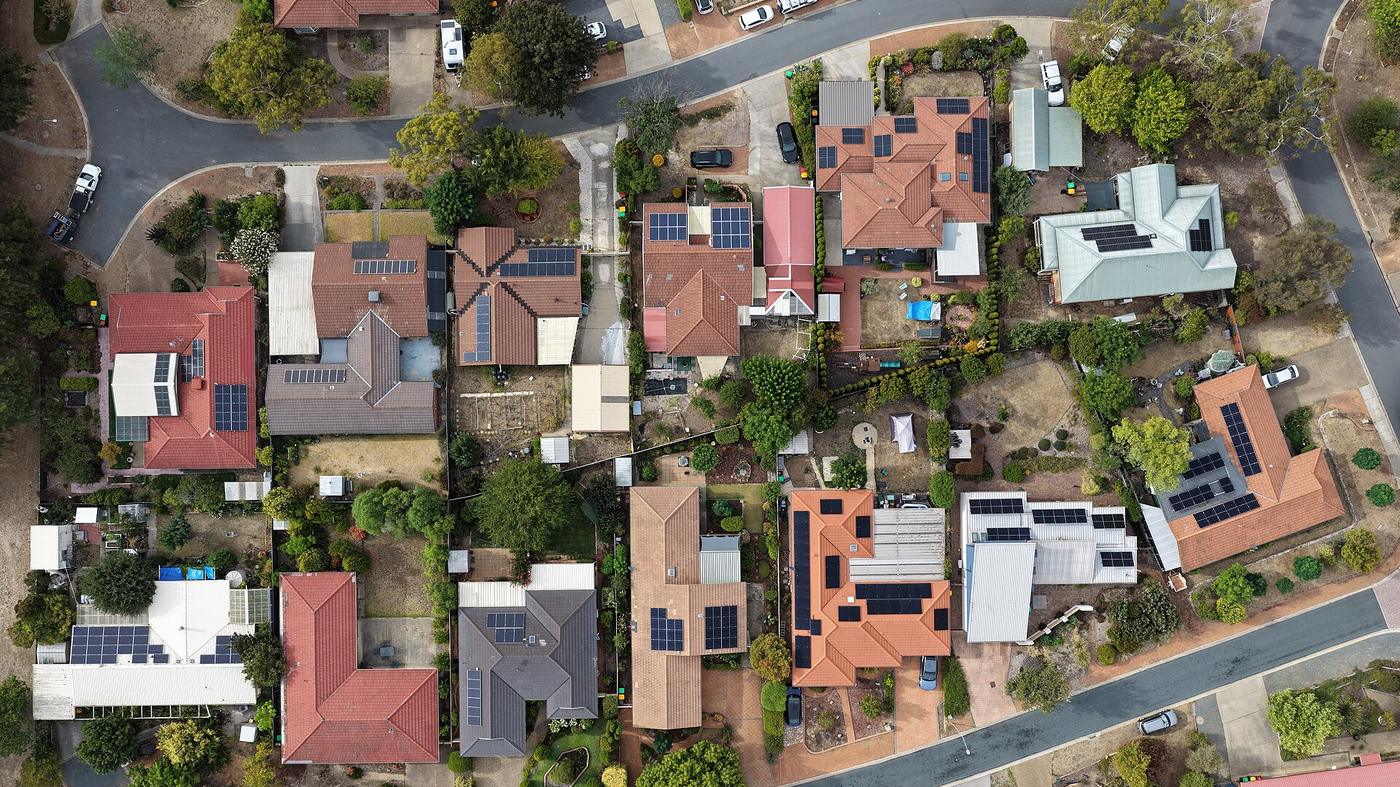 Suburban rooftops fitted with solar panels, the household segment that absorbs most of the locally supplied residential storage capacity