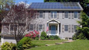Rooftop solar panels on a suburban family home - the typical site for a home battery payback calculation in 2026